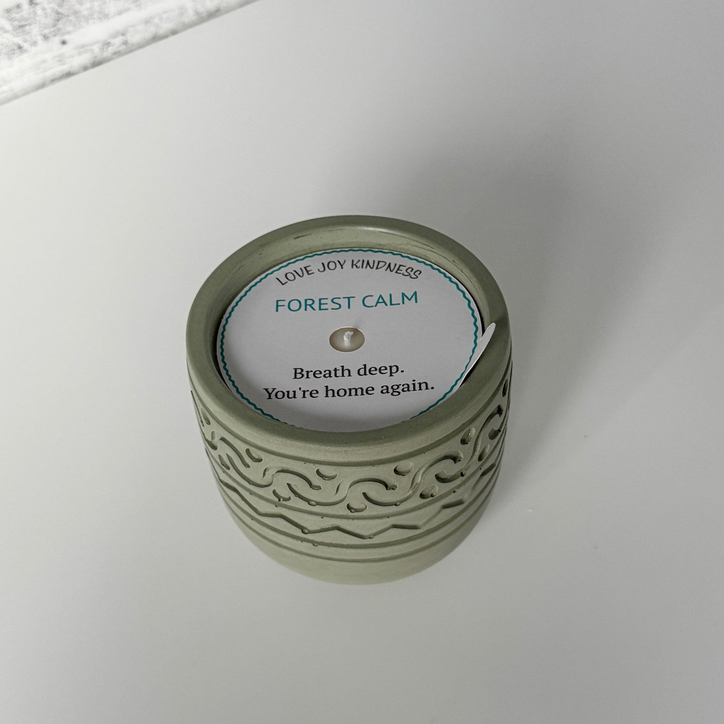 Forest Calm Candle with white dust cover label
